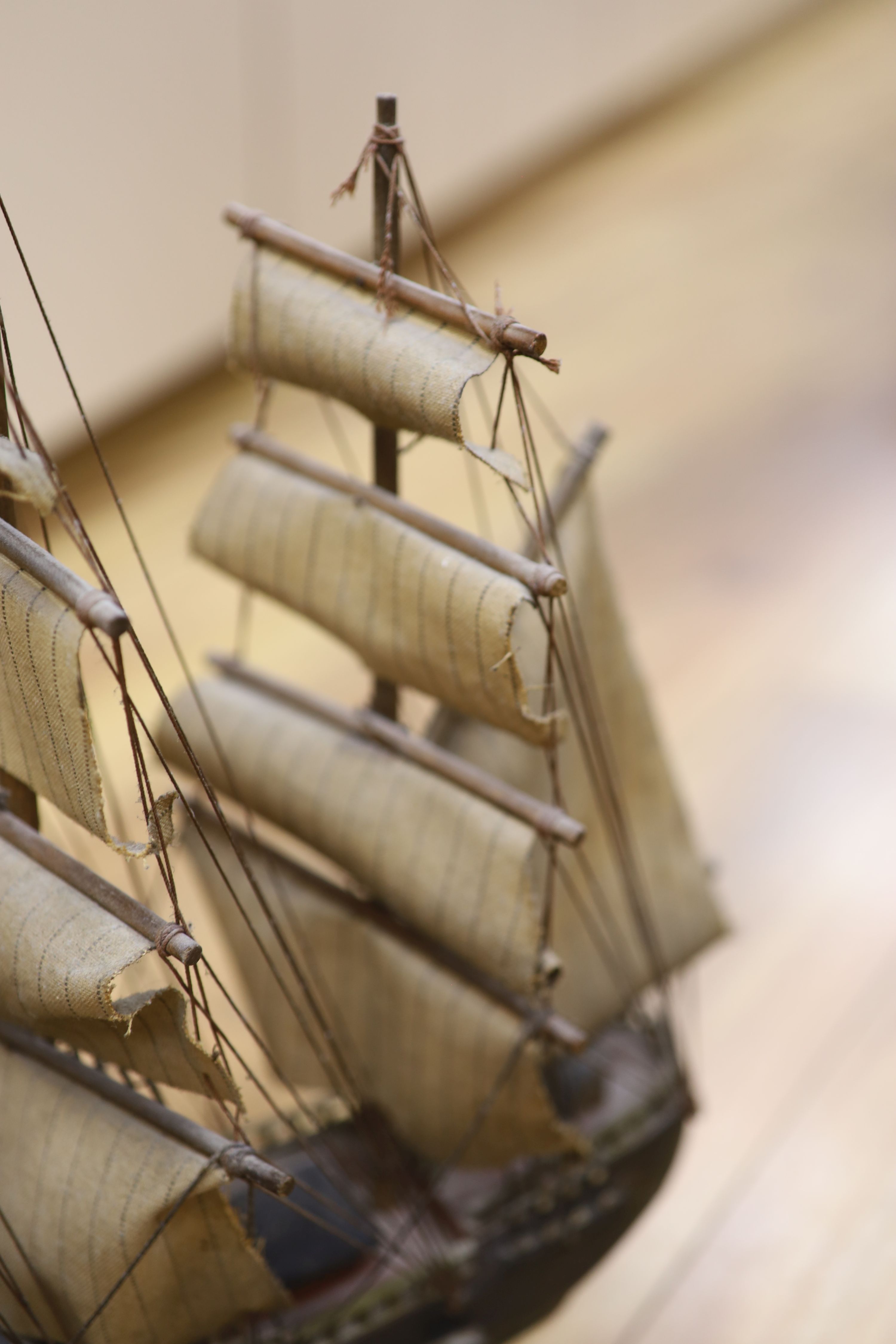 Three model ships: The Cutty Sark, The USS Constitution and Fragata, together with a carved wood Marlin